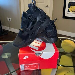 Black on black Nike Huarache City sneakers